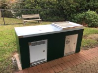 Custom double gas BBQ cabinet with front access door 